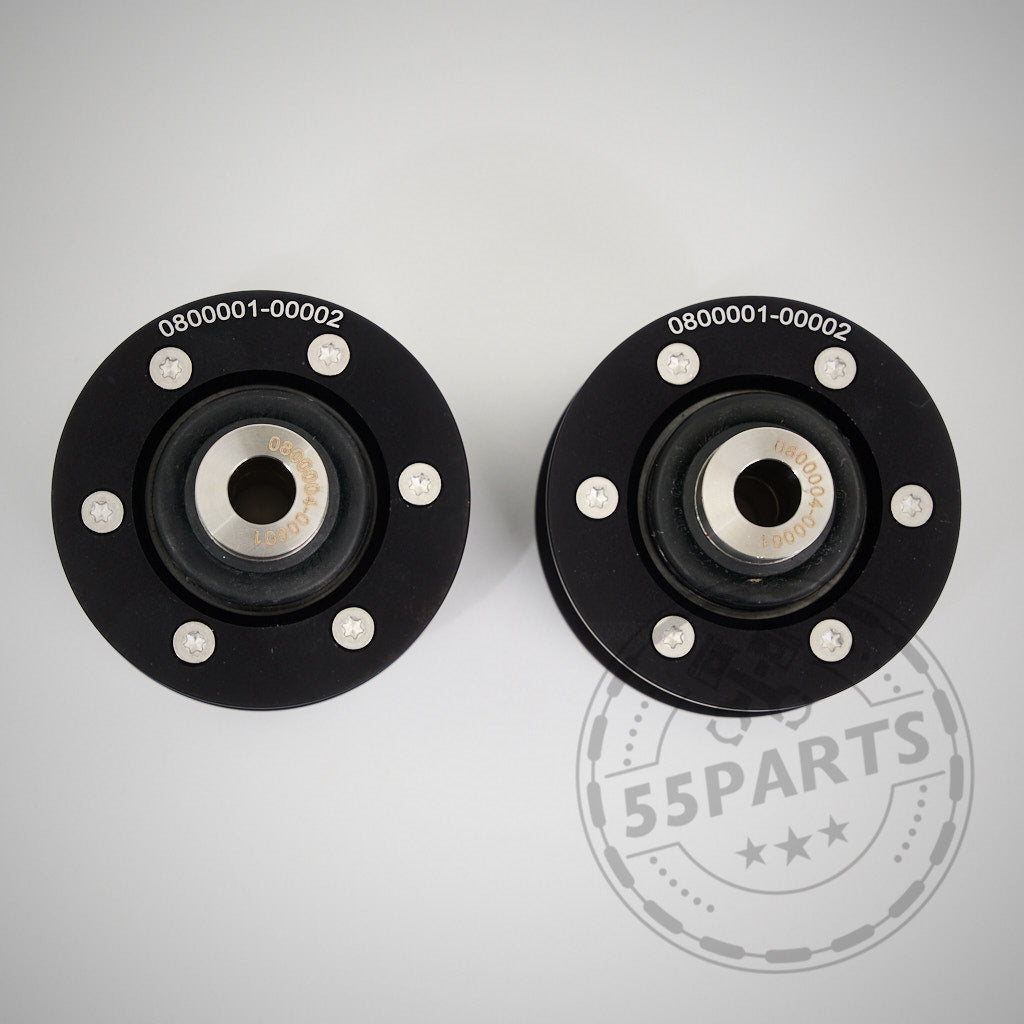 Zwei schwarze runde 55Parts NoFlex-Lager (Uniball Lager vordere Zugstrebe) passend für BMW 1-4er F-Serie inkl. xDrive werden nebeneinander auf hellem Hintergrund angezeigt, perfekt für Fahrwerks-Upgrades und Fahrzeugmodifikationen.