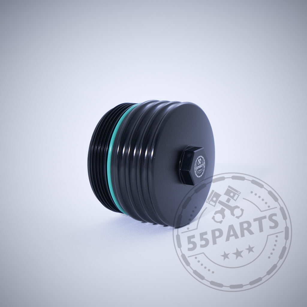 55Parts Exclusive Aluminium Ölfilterkappe mit Sechskant passend für BMW N20, N57, N52, N53, N54, N55, S55, B46, B48, B57 und B58 – schwarze gerippte Kappe mit grünem O-Ring auf hellem Hintergrund mit Wasserzeichen.