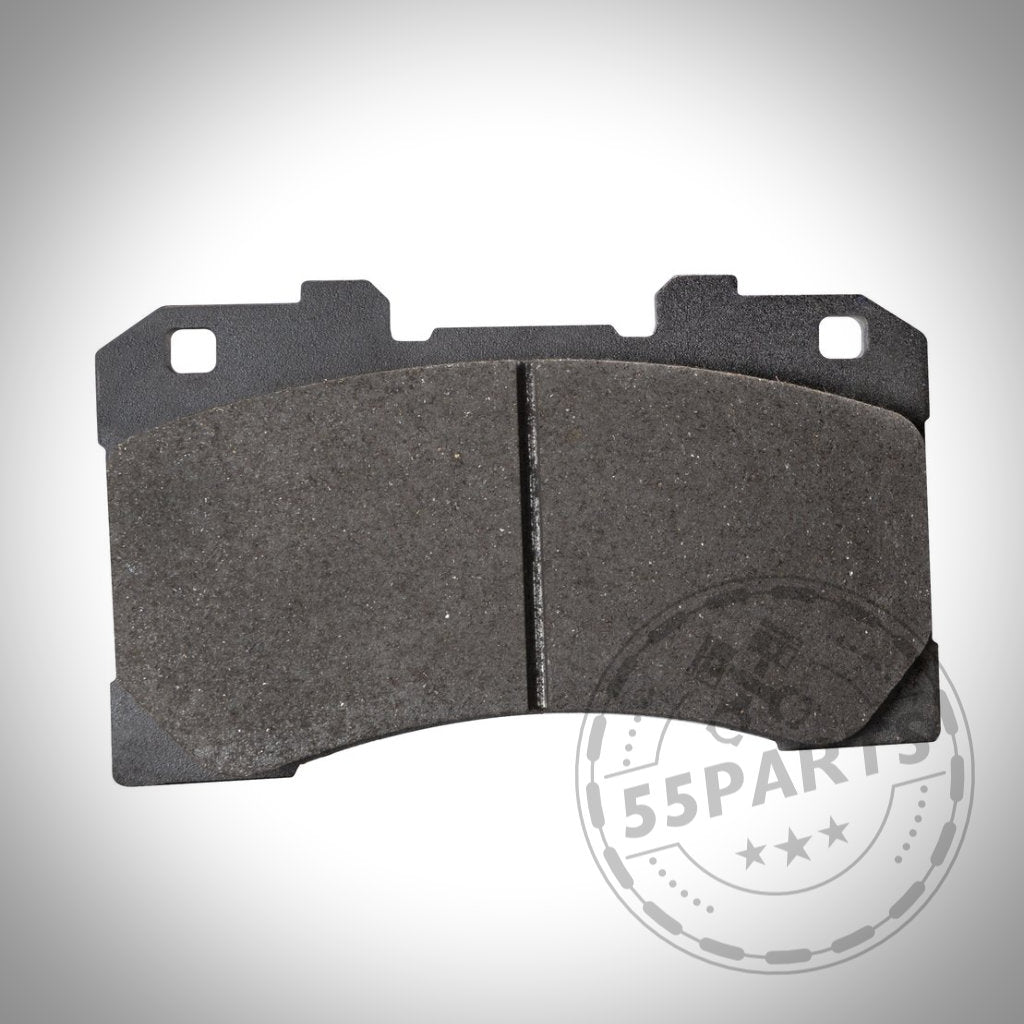 Der 55Parts EBC Rennbremsbeläge RP-X, RP-1 für Toyota Yaris GR ist ein einzelner Bremsbelag mit zwei Befestigungslöchern, von oben auf weißem Hintergrund mit einem schwachen Wasserzeichen dargestellt.