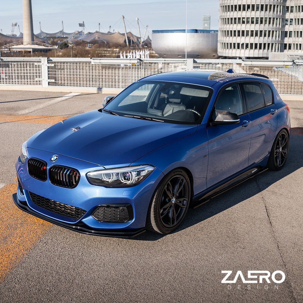 Ein BMW F2x Fließheck mit einem ZAERO Evo-1 Frontspoiler ist in einer städtischen Umgebung geparkt.