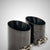 Doppelte schwarze perforierte Auspuffblenden passend für BMW G81, G82, G83, G87 M2/M3/M4 (Competition/Touring) mit S58-Motor; abgewinkelte Blenden mit verstellbaren Klemmen, nebeneinander auf hellem Hintergrund dargestellt.