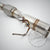 Nahaufnahme einer 55Parts Catless Katlose-Downpipe (DPF-Entfernung) passend für BMW 116d, 118d, 120d, 123d, 318d, 320d und 520d E-Serie N47 mit Schweißverbindungen und Anschlüssen auf weißem Hintergrund.