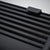 Nahaufnahme eines schwarzen 55Parts Upgrade-Ladeluftkühlers aus Metall mit horizontalen Kühlrippen, passend für die Modelle BMW 325d, 330d und 335d M57.