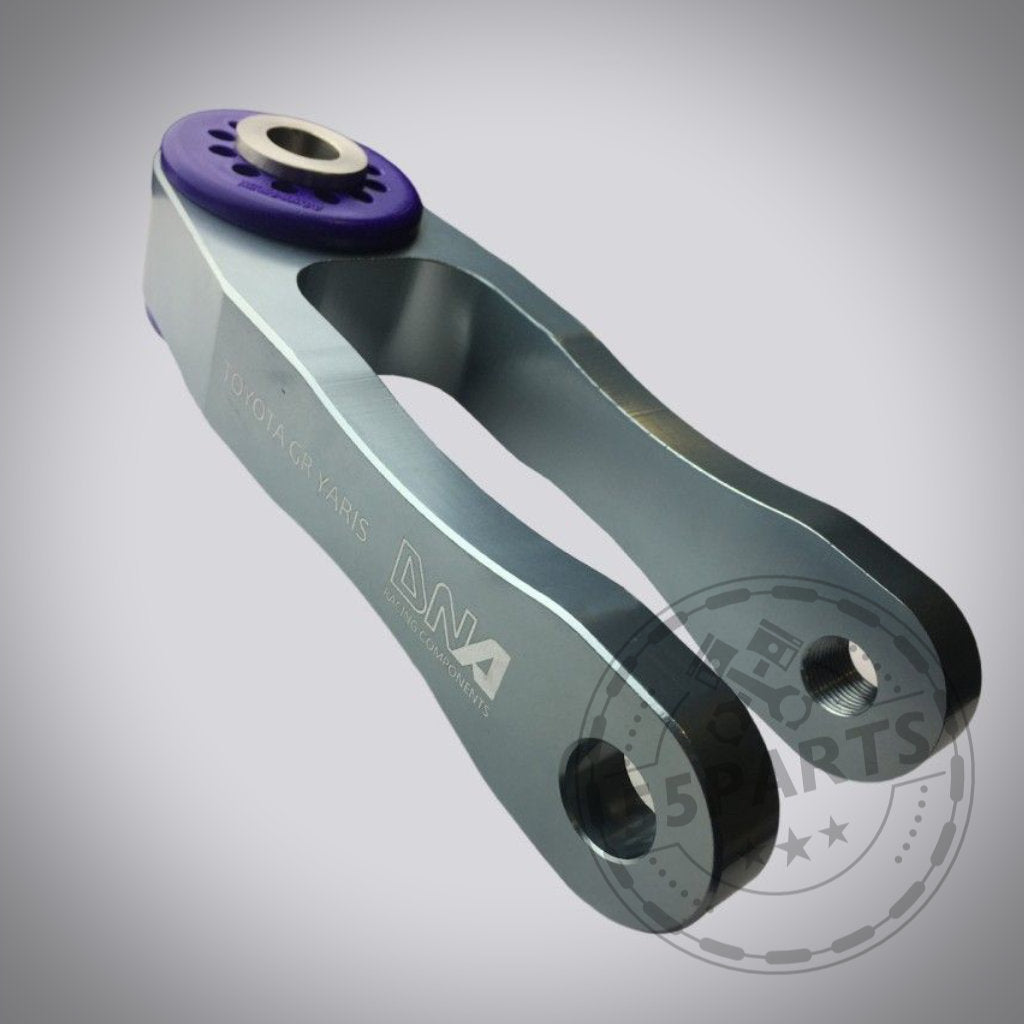 DNA Racing Upgrade Drehmoment Stütze Motorlager passend für Toyota Yaris GR mit lila Buchse auf weißem Hintergrund – ideal für Fahrspaß und jetzt im Tuning Shop erhältlich.