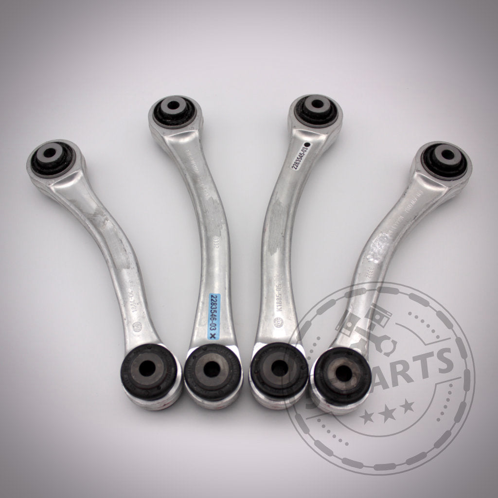 Vier M3 Fahrwerkskomponenten (mit NoFlex-Lagern) Komplettset – Uniball Zugstrebenlager passend für BMW 1er E8x &amp; 3er E9x, nebeneinander auf einer hellen Oberfläche mit dem Fahrwerk-Parts-Logo dargestellt – perfekt für Upgrades und Modifikationen.