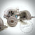 Nahaufnahme eines Pure Turbos Pure Stage 2 Casted Turbo passend für BMW 135i, 1er M Coupé und 335i(x) N54; metallische Turbinenschaufeln unterstreichen Qualität und Wert. Dezentes 55Parts-Wasserzeichen ist sichtbar.